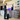 Person checking in at a hotel reception desk with a front desk staff member.